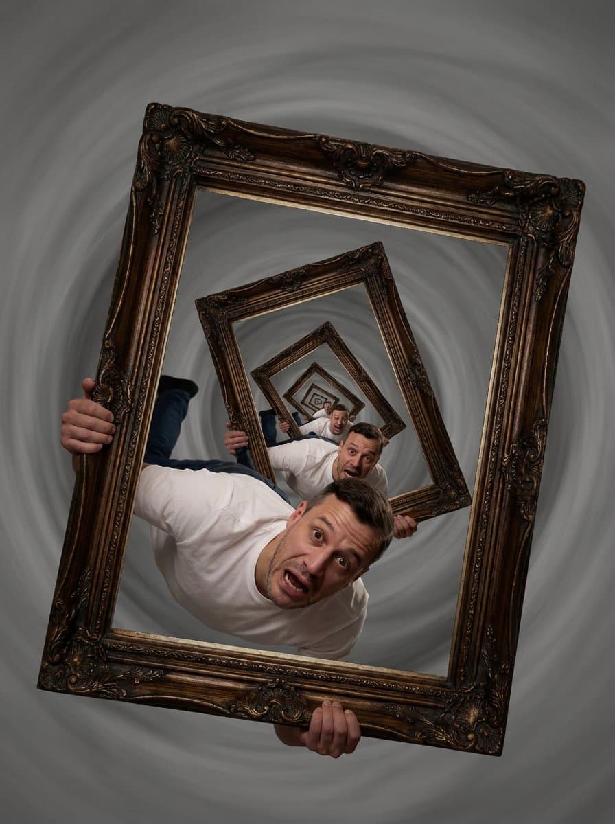 A man is trapped inside a nesting doll of picture frames.